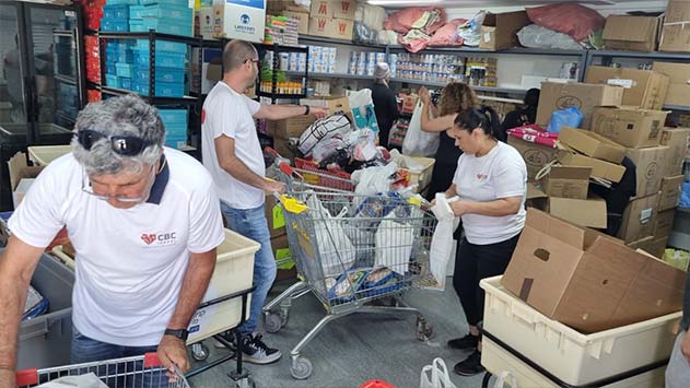 מאות סלי מזון ותווי קניה חולקו למשפחות  לקראת חג ראש השנה